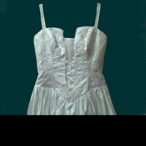 White wedding dress with bead accents and long train. Size 10